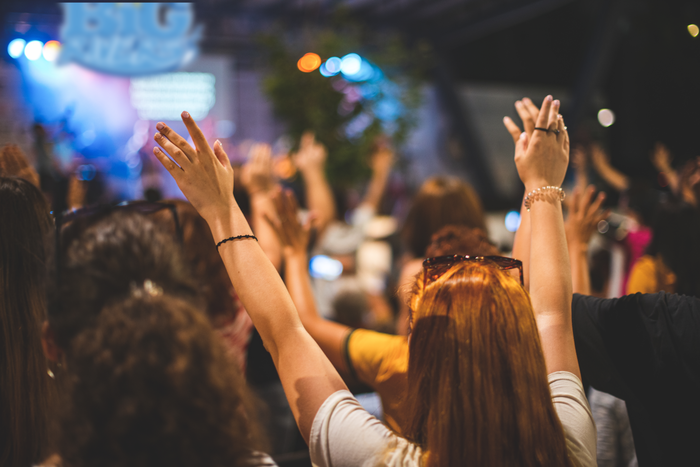 church event - people with hands raised